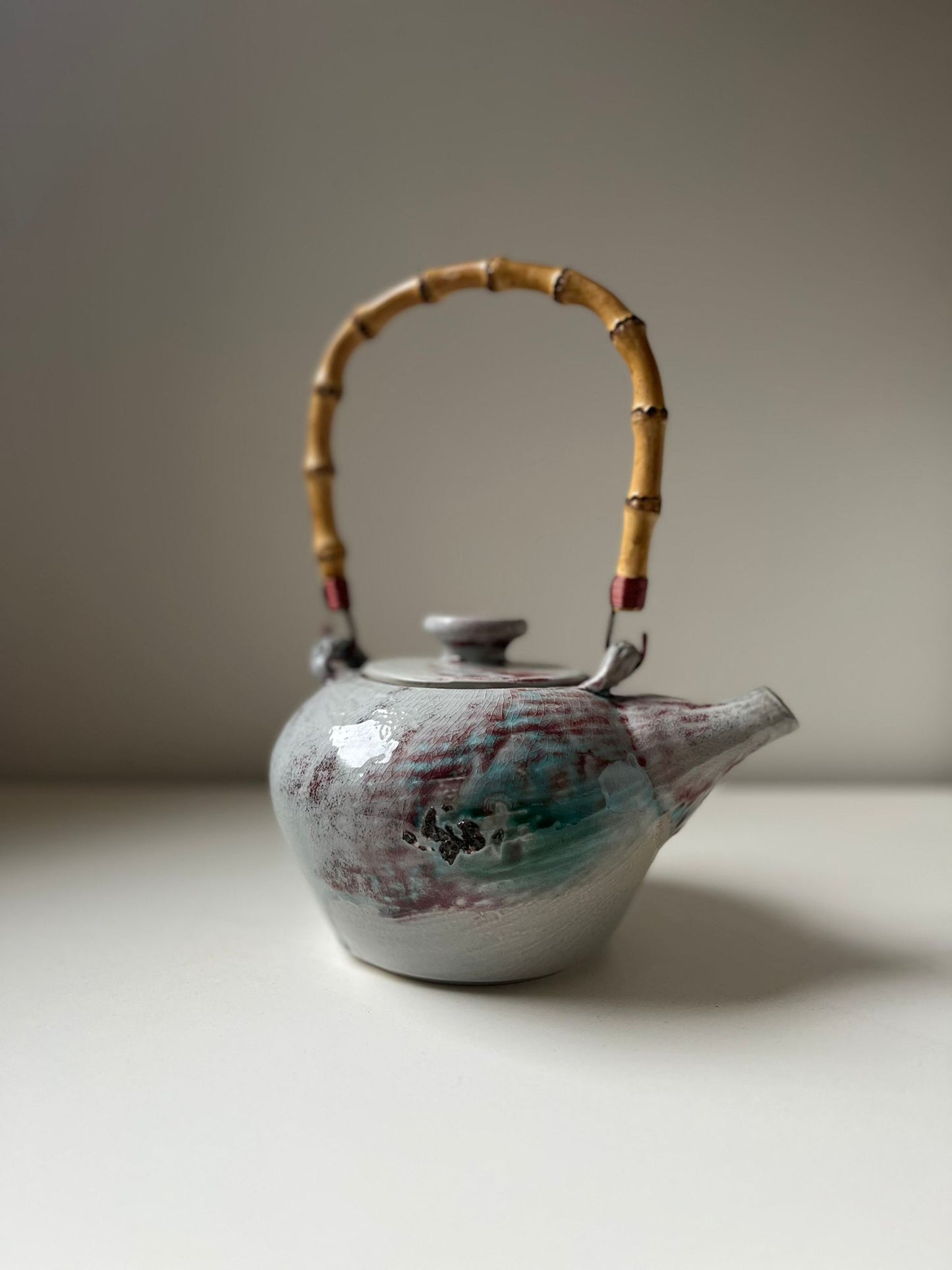 Salt fired teapot with cane handle